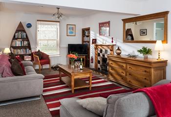 The cosy sitting room has a sofa bed for the extra guests.