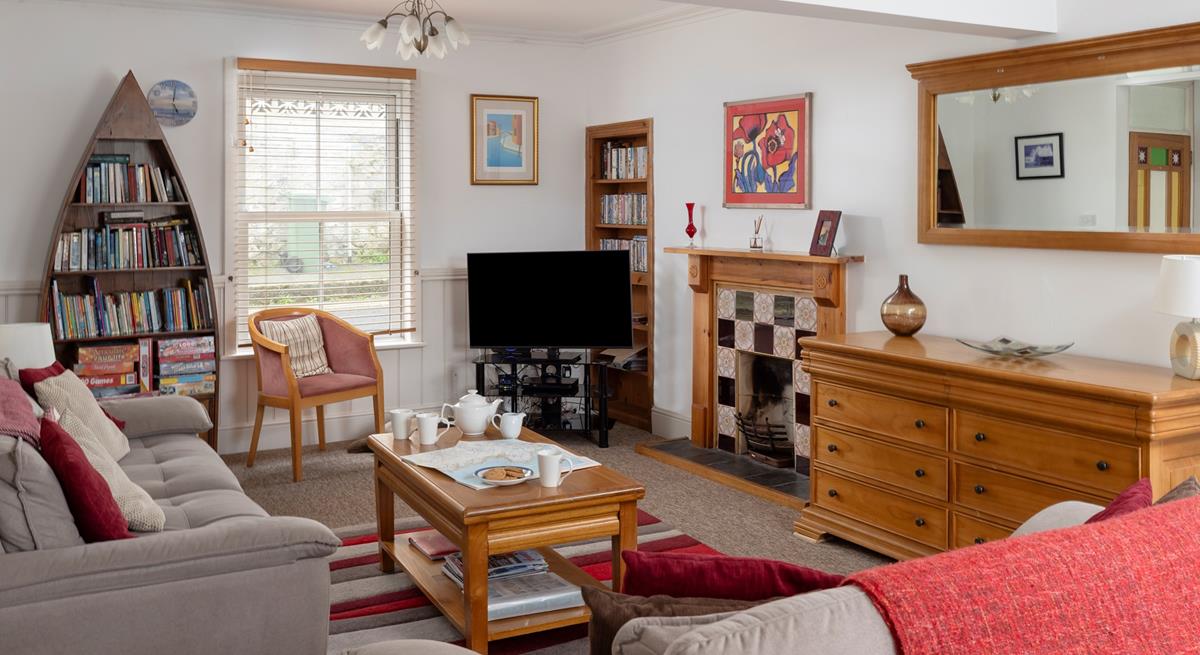 The cosy sitting room has a sofa bed for the extra guests.