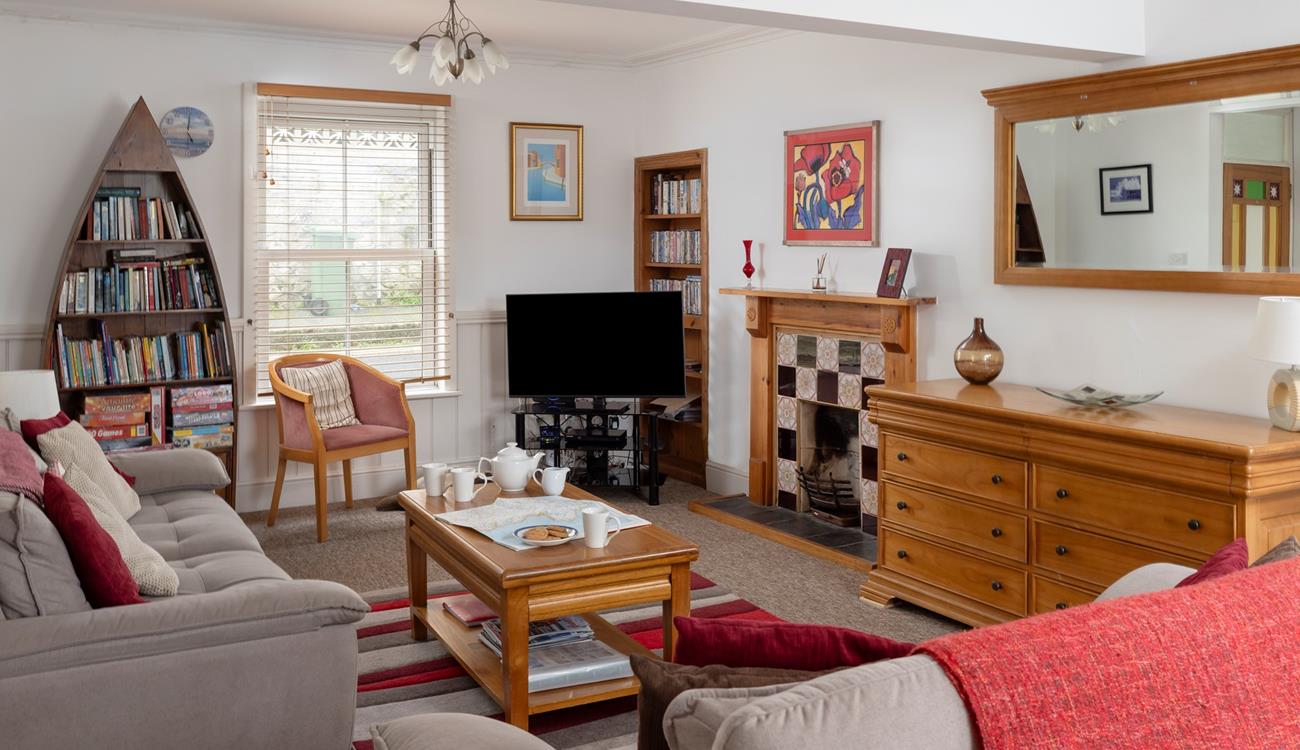 The cosy sitting room has a sofa bed for the extra guests.