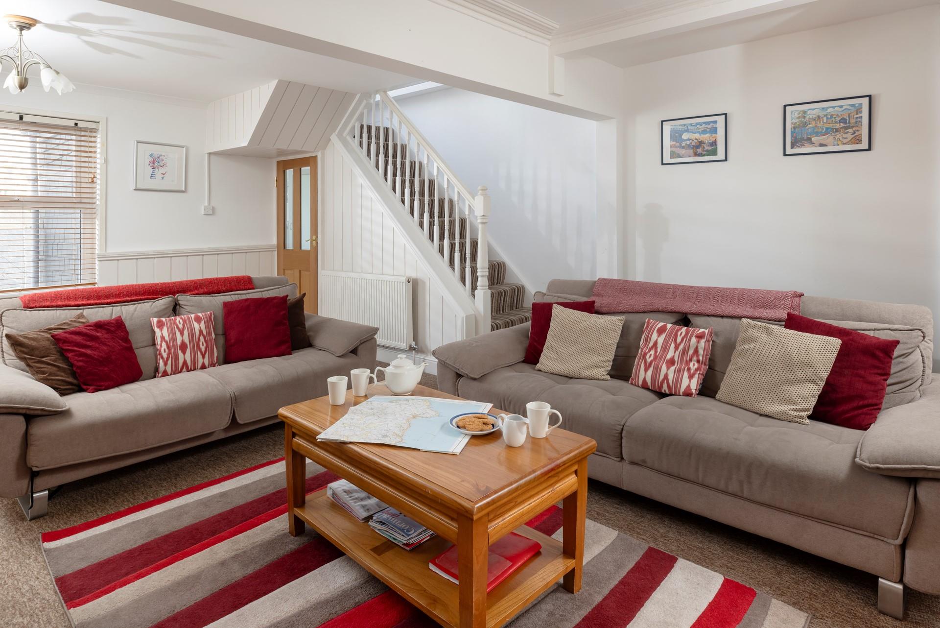 Relax in the charming sitting area after a lovely long walk along the coast.