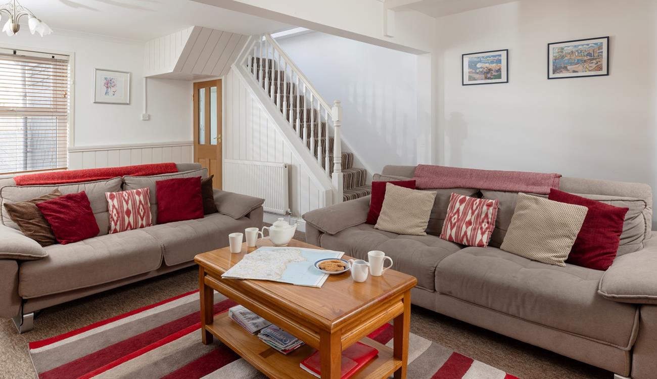 Relax in the charming sitting area after a lovely long walk along the coast.