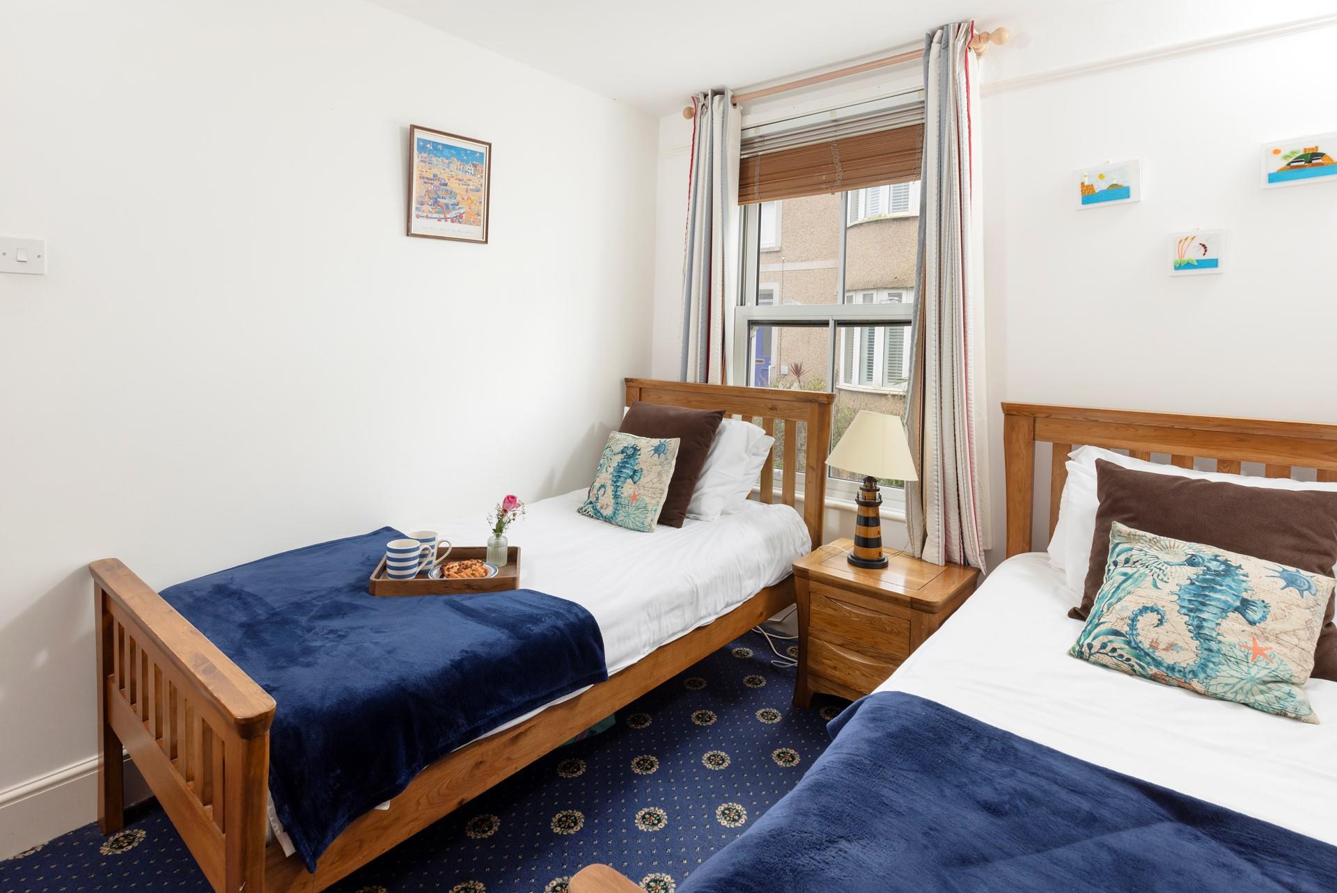 The twin beds are ideal for children or young adults.