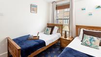 The twin beds are ideal for children or young adults.