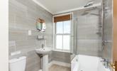 Modern bathroom with bath - perfect to relax in after a long day! - Thumbnail Image