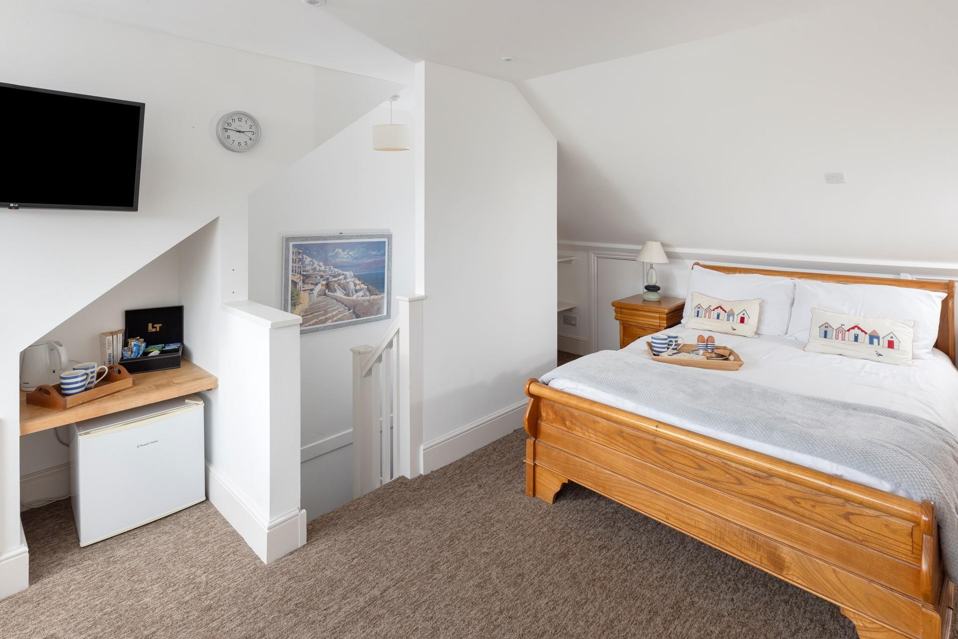 The loft has been converted into a lovely double bedroom.