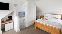 The loft has been converted into a lovely double bedroom.