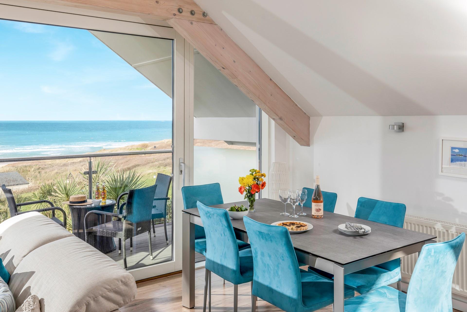 Pour yourself a glass of wine and watch the waves roll onto the beach.