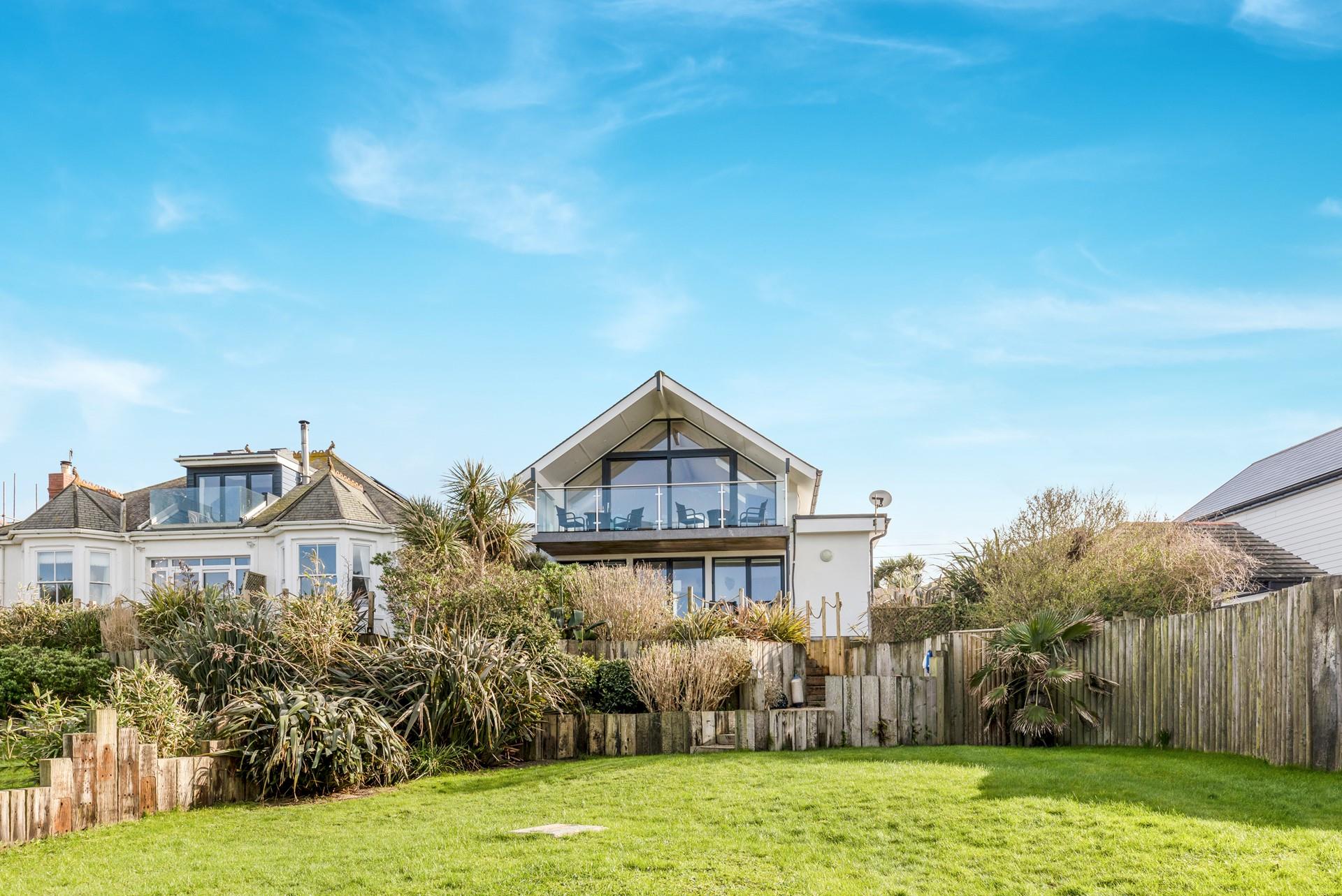 Open a bottle of your favourite wine and spend all evening on your balcony staring out to sea.