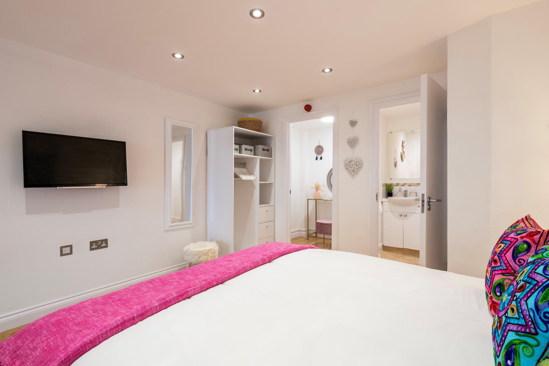 There is plentiful wardrobe space in the spacious bedroom area.