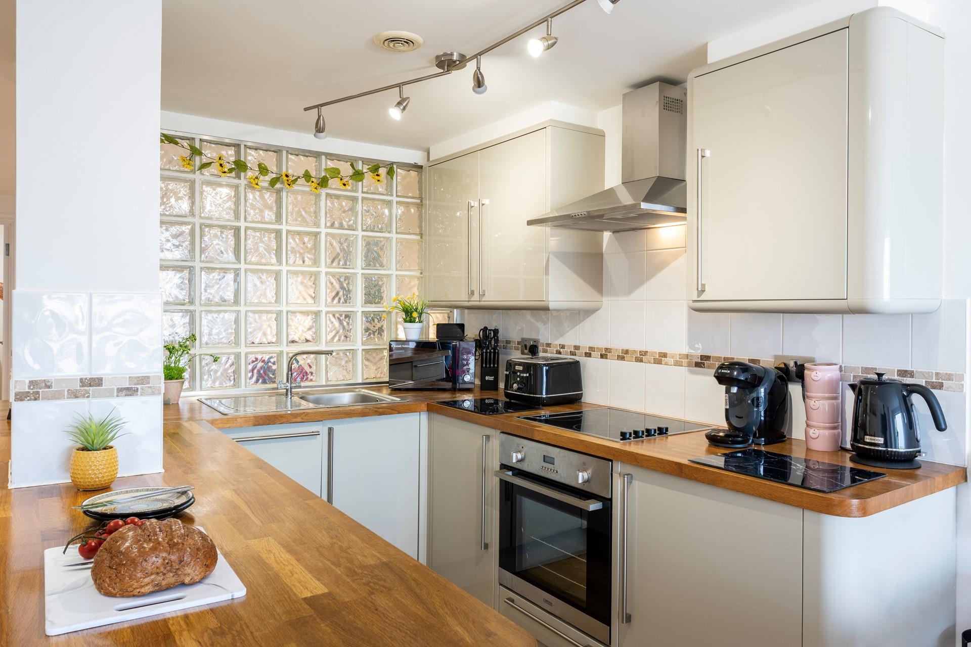 The kitchen is modern and well-equipped for cooking tasty meals and preparing picnics.