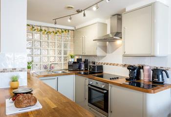 The kitchen is modern and well-equipped for cooking tasty meals and preparing picnics.
