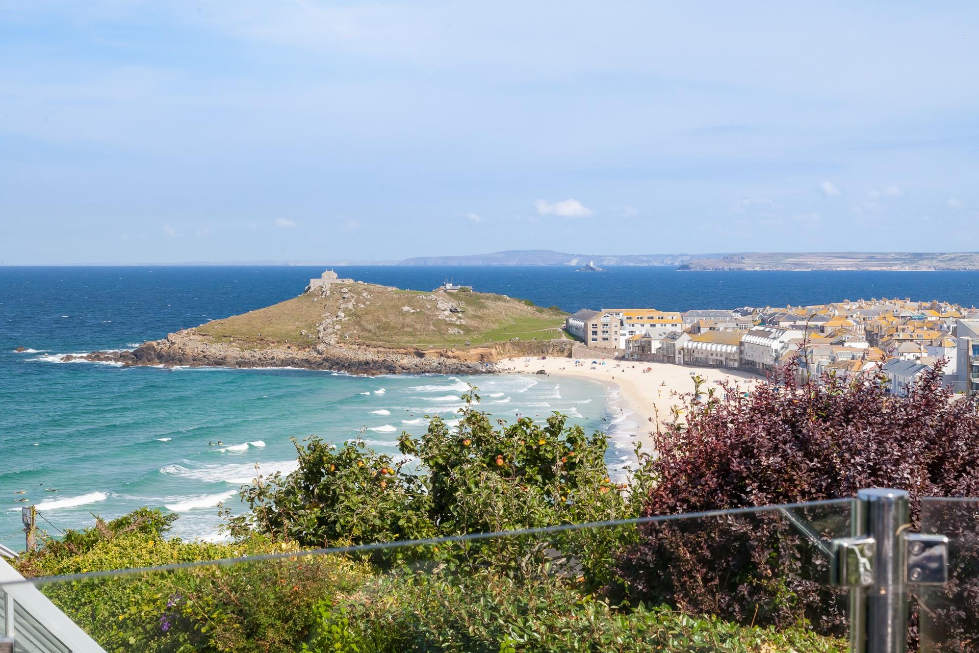 From the glass patio balcony, you have a birds-eye stunning view across Porthmeor beach and for miles beyond.
