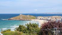 From the glass patio balcony, you have a birds-eye stunning view across Porthmeor beach and for miles beyond.