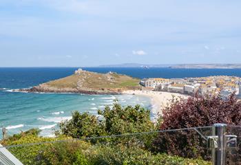 From the glass patio balcony, you have a birds-eye stunning view across Porthmeor beach and for miles beyond.