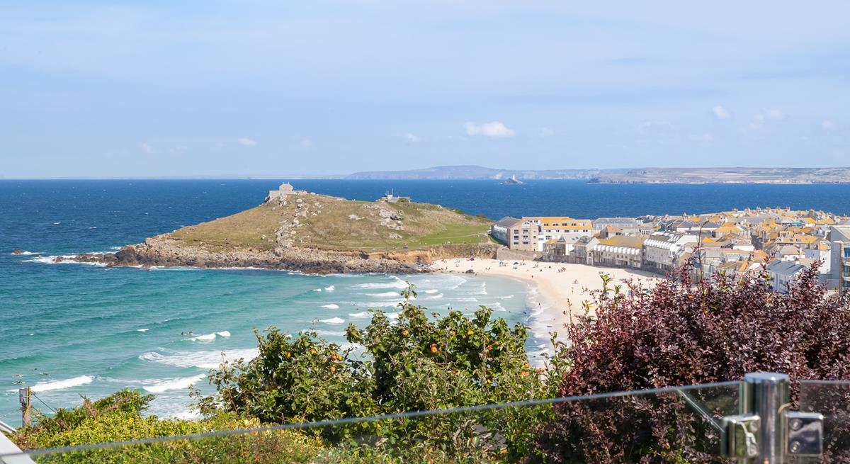 From the glass patio balcony, you have a birds-eye stunning view across Porthmeor beach and for miles beyond.