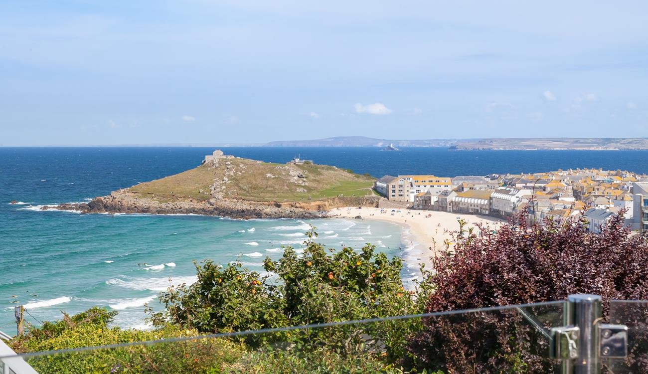 From the glass patio balcony, you have a birds-eye stunning view across Porthmeor beach and for miles beyond.