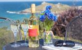 Enjoy a glass of wine and a good read on the terraced patio overlooking Porthmeor beach and the Island. - Thumbnail Image