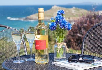 Enjoy a glass of wine and a good read on the terraced patio overlooking Porthmeor beach and the Island.