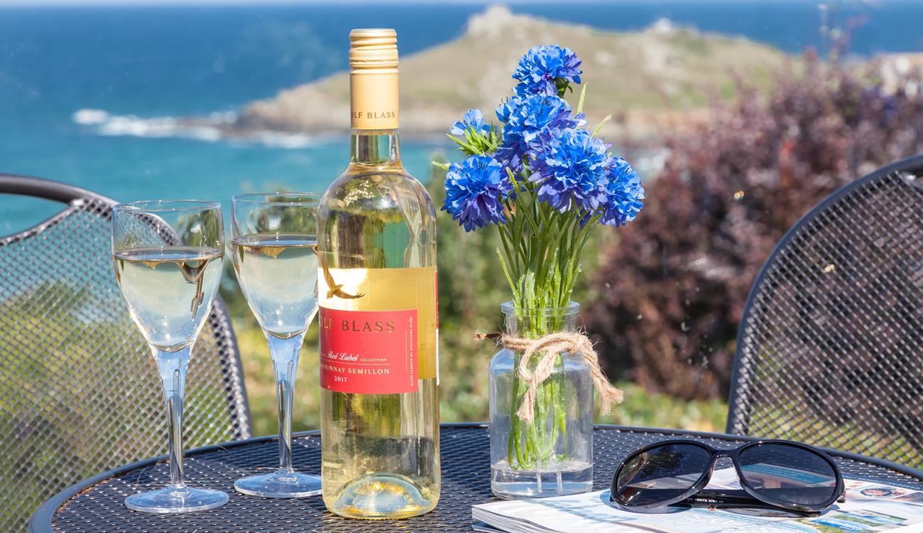 Enjoy a glass of wine and a good read on the terraced patio overlooking Porthmeor beach and the Island.