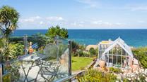Wander back to this seaside retreat after a day on the beach.