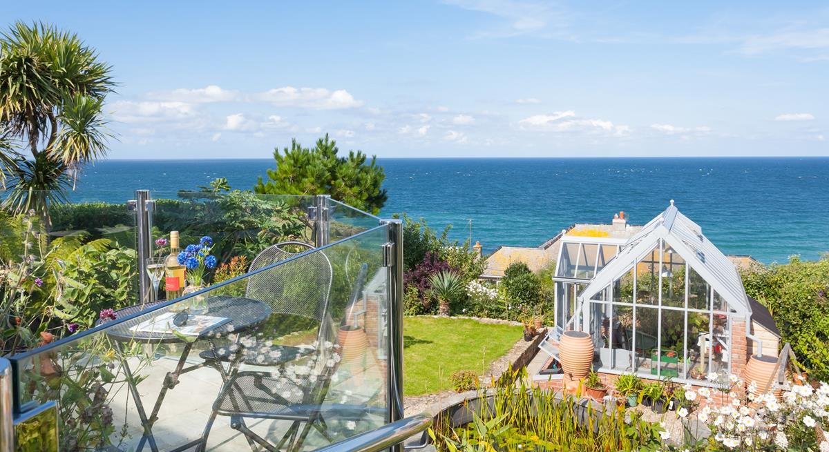 Wander back to this seaside retreat after a day on the beach.