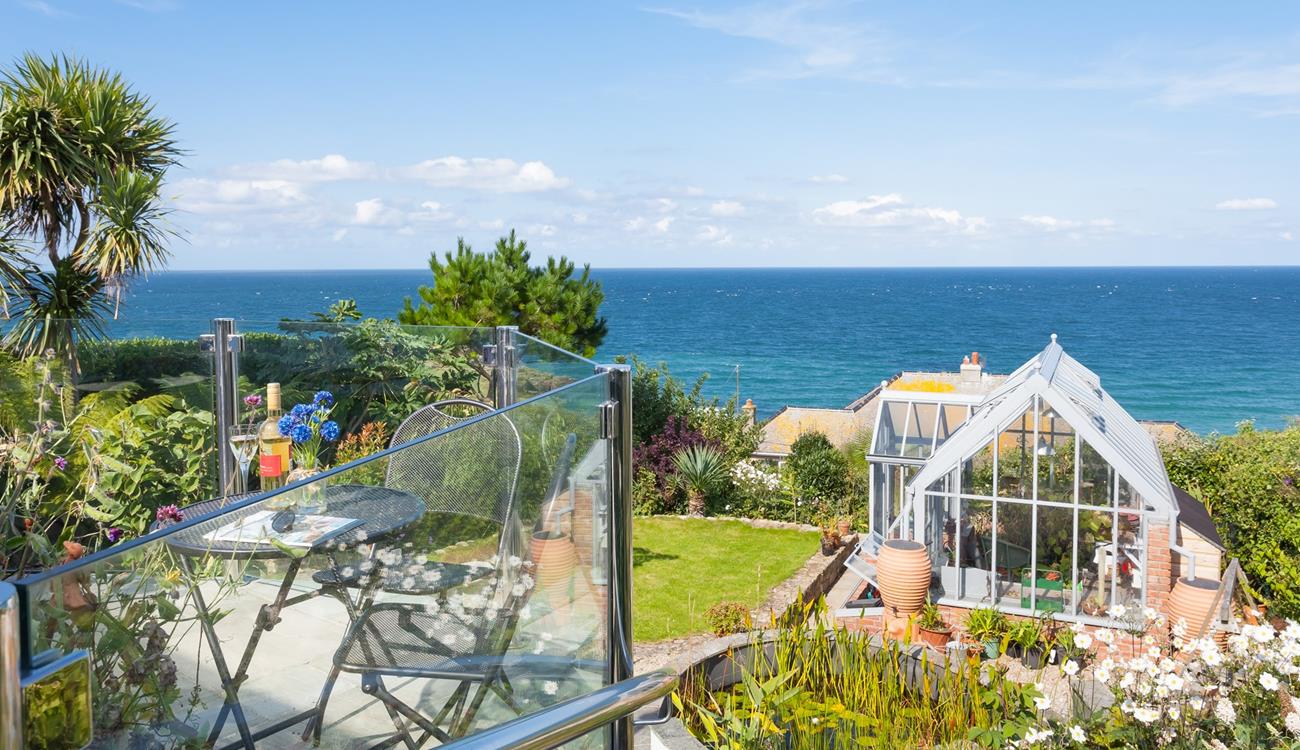 Wander back to this seaside retreat after a day on the beach.