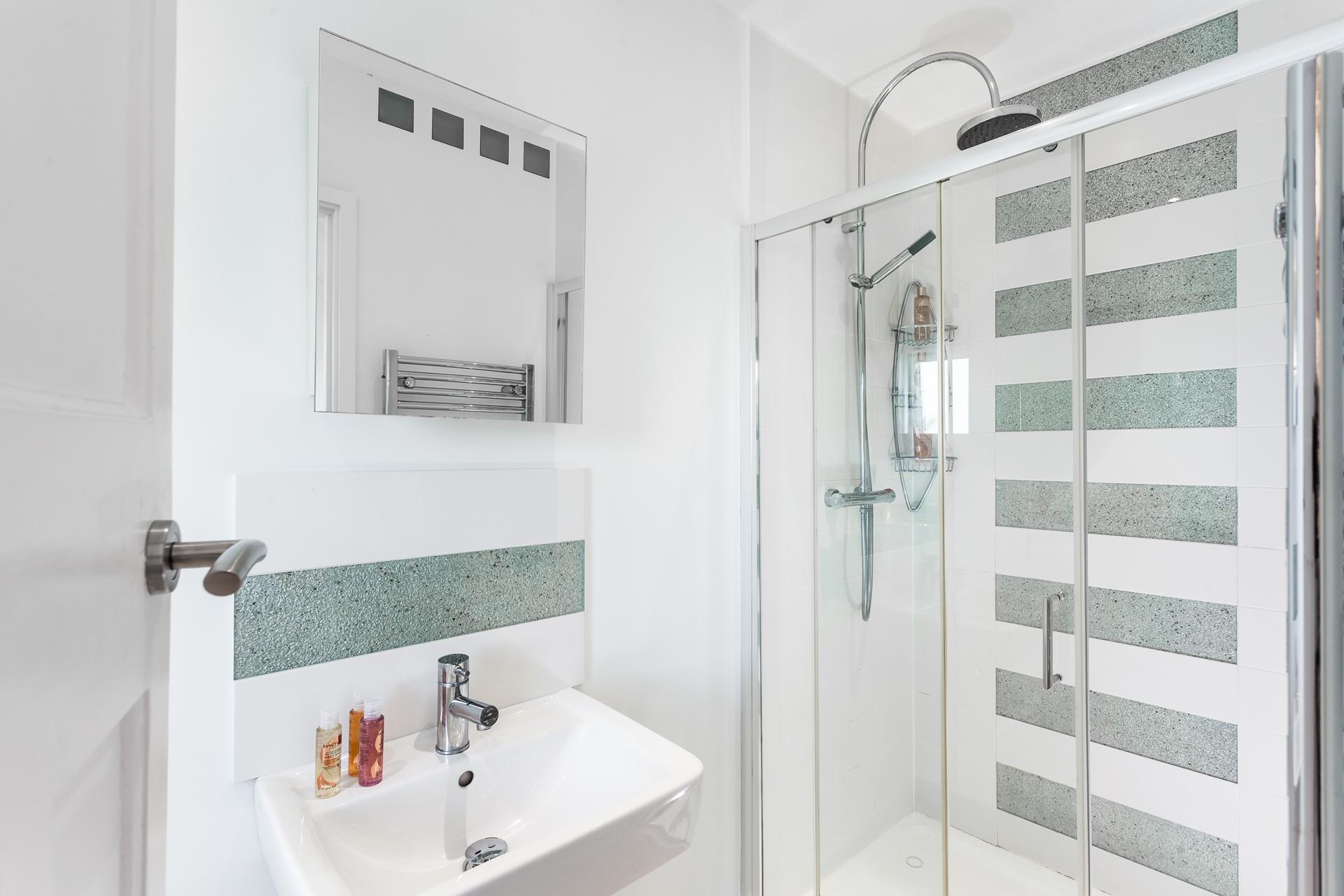 Wander into the ensuite for an invigorating morning shower.