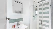 Wander into the ensuite for an invigorating morning shower.