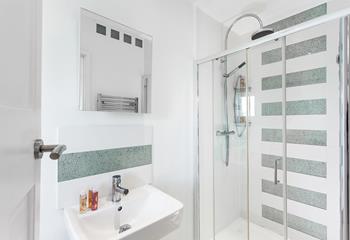 Wander into the ensuite for an invigorating morning shower.