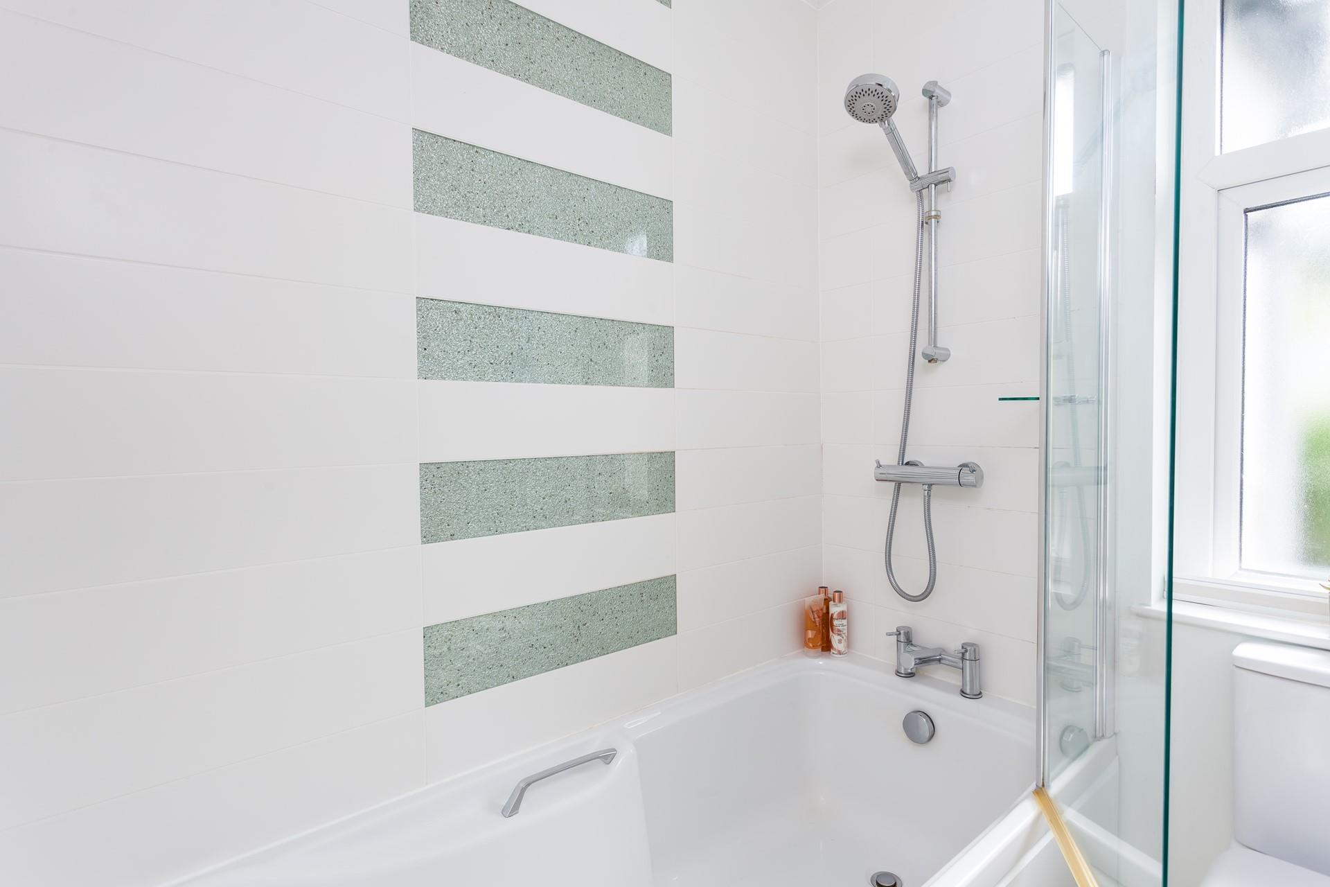 Wash off sandy toes in the shower after a day on Porthmeor.