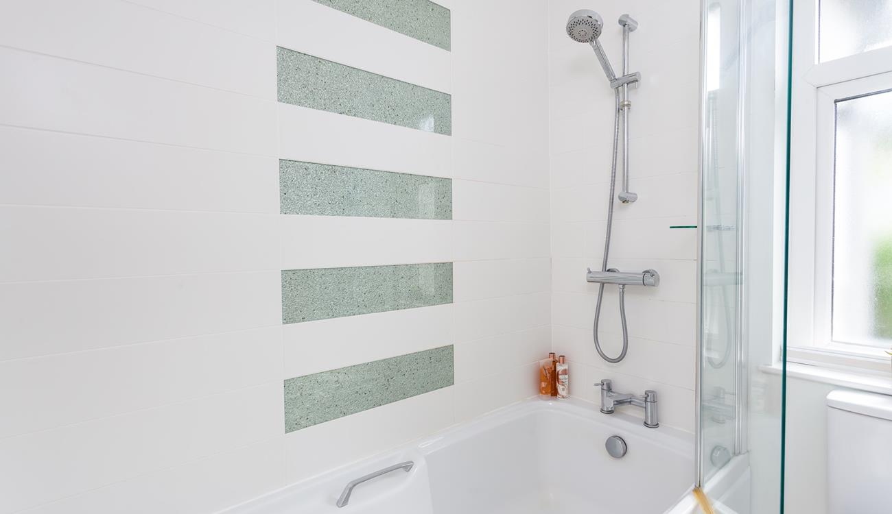 Wash off sandy toes in the shower after a day on Porthmeor.