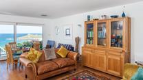 The dining table is positioned perfectly to enjoy the view at meal times.