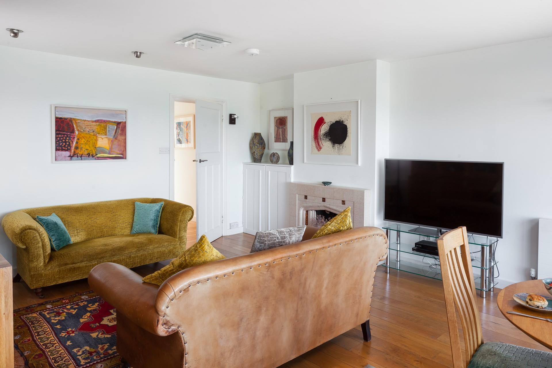 Relax in the sitting room after watching the sun come down on the terrace.