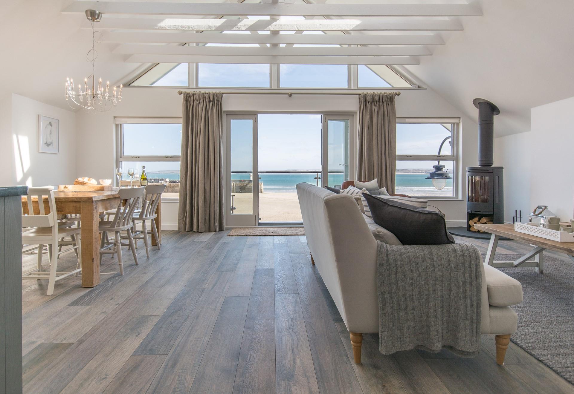 Gorgeous open plan living ensures the space is bright and airy, whilst the apex window makes the most of the incredible views.