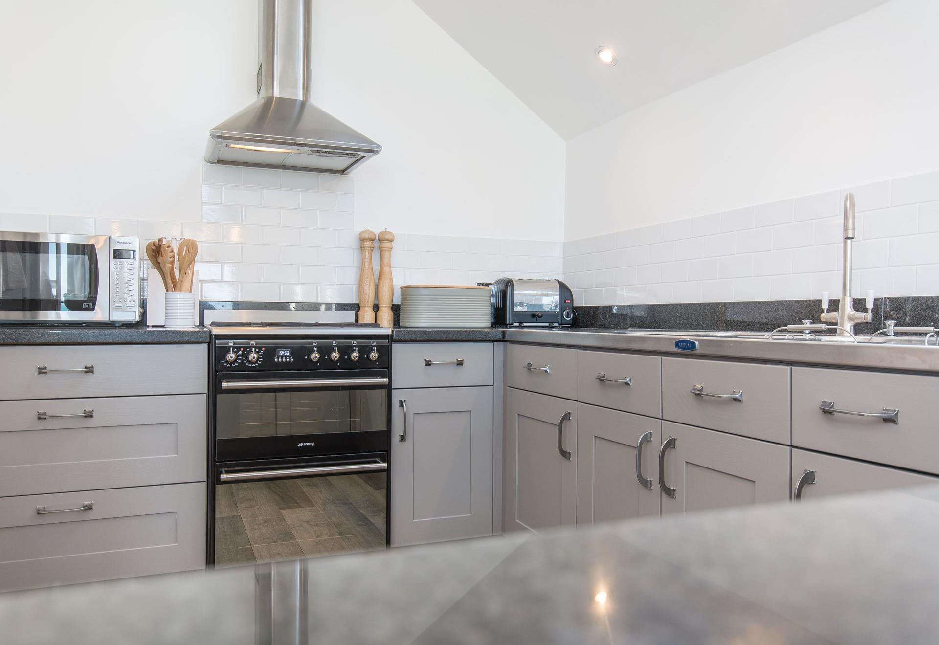 The kitchen is spacious and fabulously well-equipped with modern appliances.