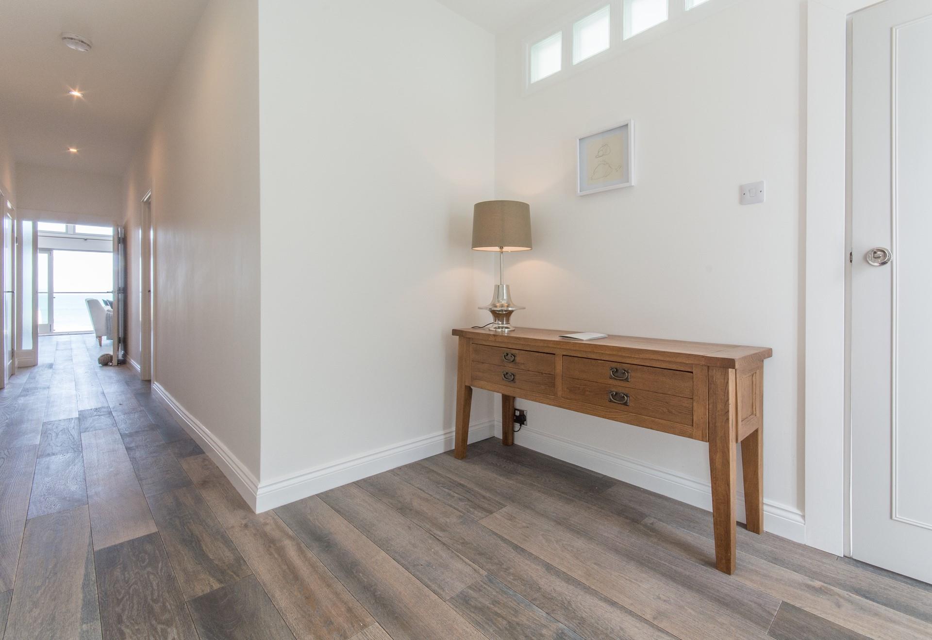 The entrance is spacious, offering you plenty of room to kick off your shoes and explore your home from home.