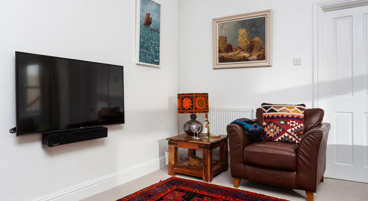 Open a bottle of wine to enjoy after a day sunbathing on the beach.