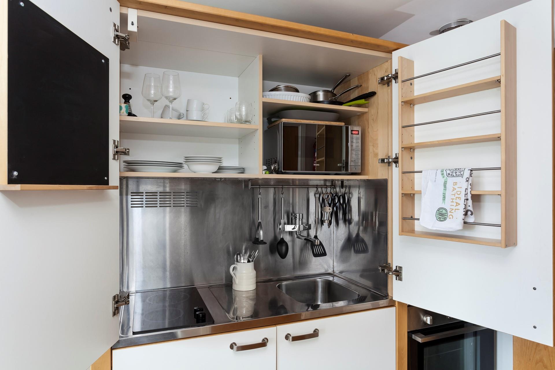 Though small the kitchen is well-equipped making cooking homemade meals a breeze.