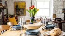 Buy some fresh ingredients in town to enjoy a family meal together.
