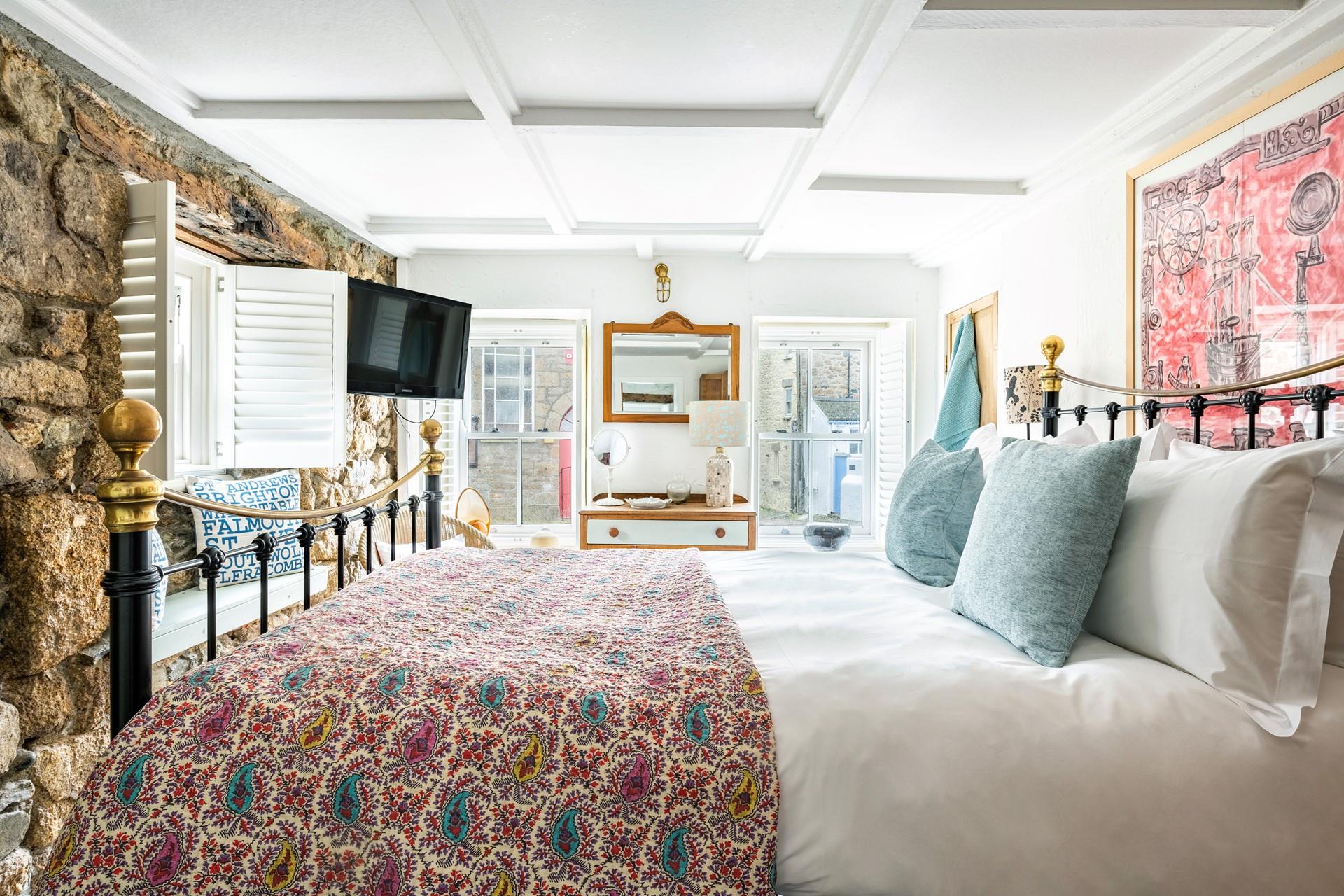 The ground floor bedroom has a king size bed to tuck yourself into for a comfy night's sleep.