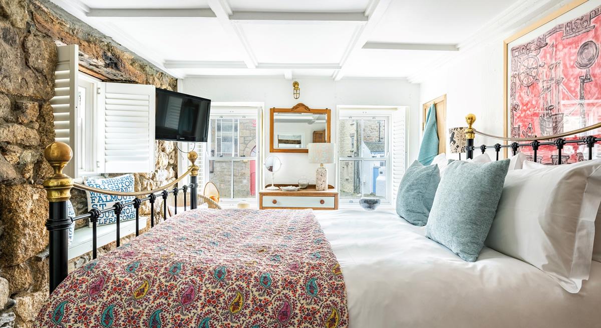 The ground floor bedroom has a king size bed to tuck yourself into for a comfy night's sleep.