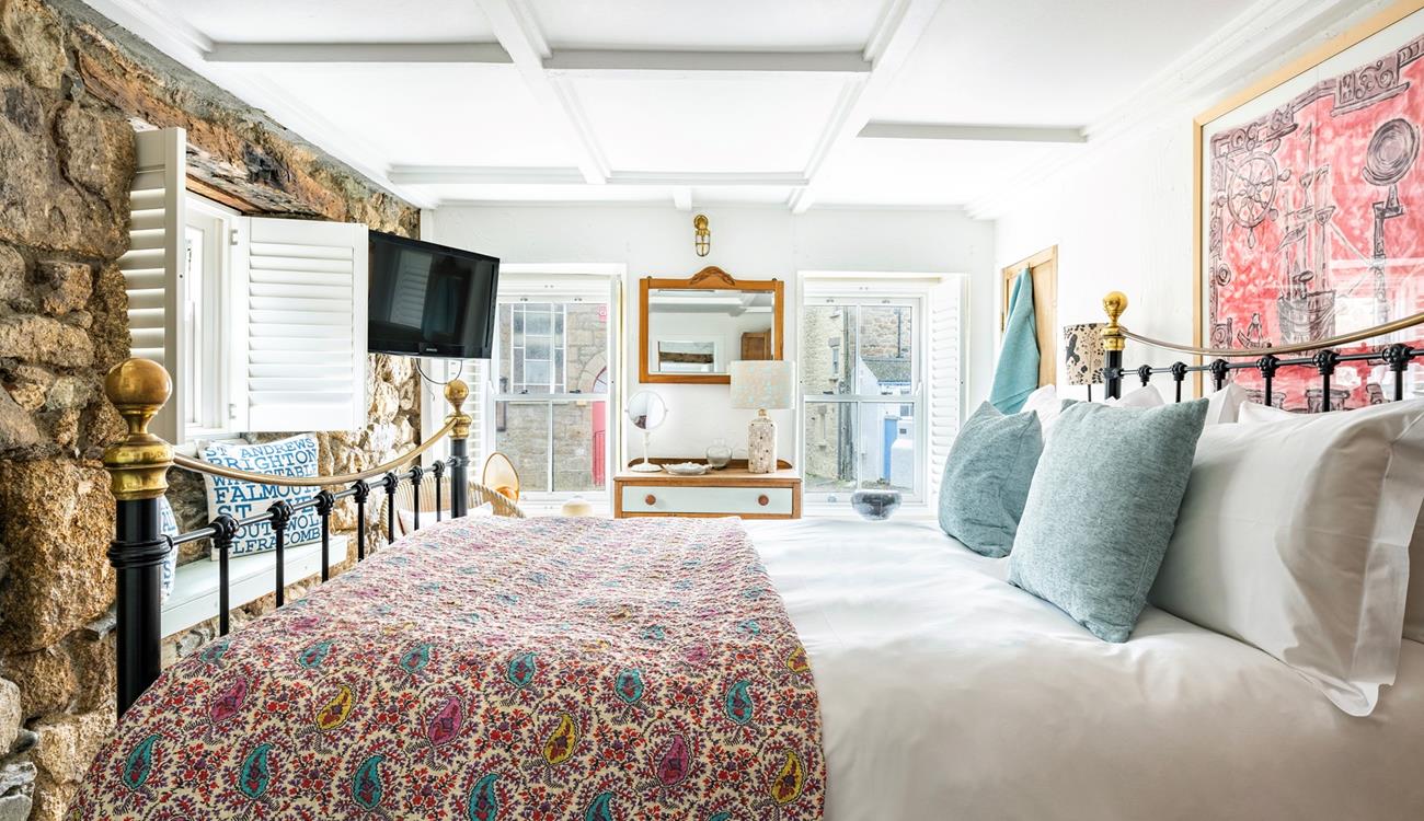 The ground floor bedroom has a king size bed to tuck yourself into for a comfy night's sleep.