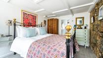 This ground floor bedroom has an en-suite for you to get ready each morning.