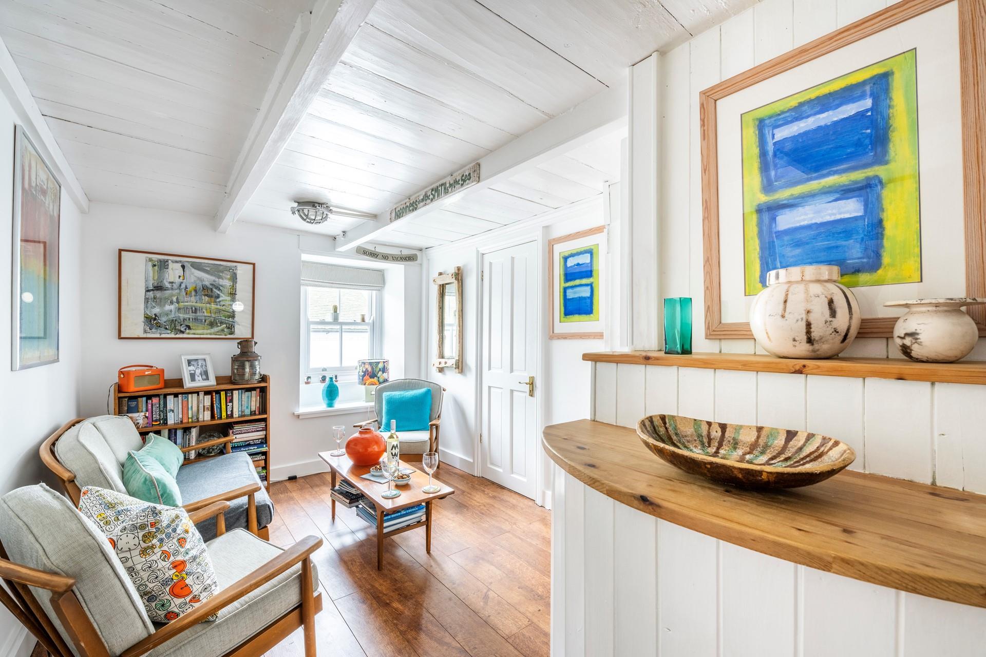 The ground floor sitting room is a quiet space to relax and enjoy some reading.