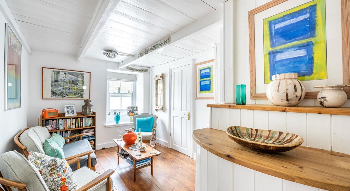 The ground floor sitting room is a quiet space to relax and enjoy some reading.