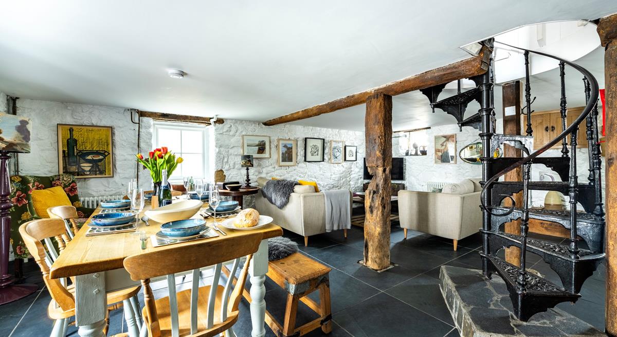 A beautiful spiral staircase leads down to the basement kitchen area.