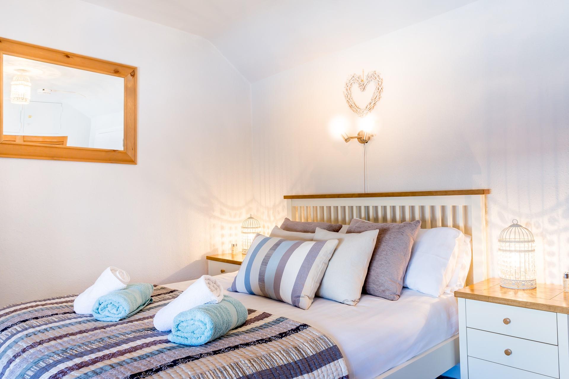 Bedroom 1 features a cosy double bed to rest your head at night.