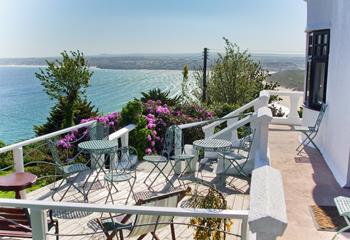 Relax on the terrace, overlooking the turquoise waters of Carbis Bay and beyond.