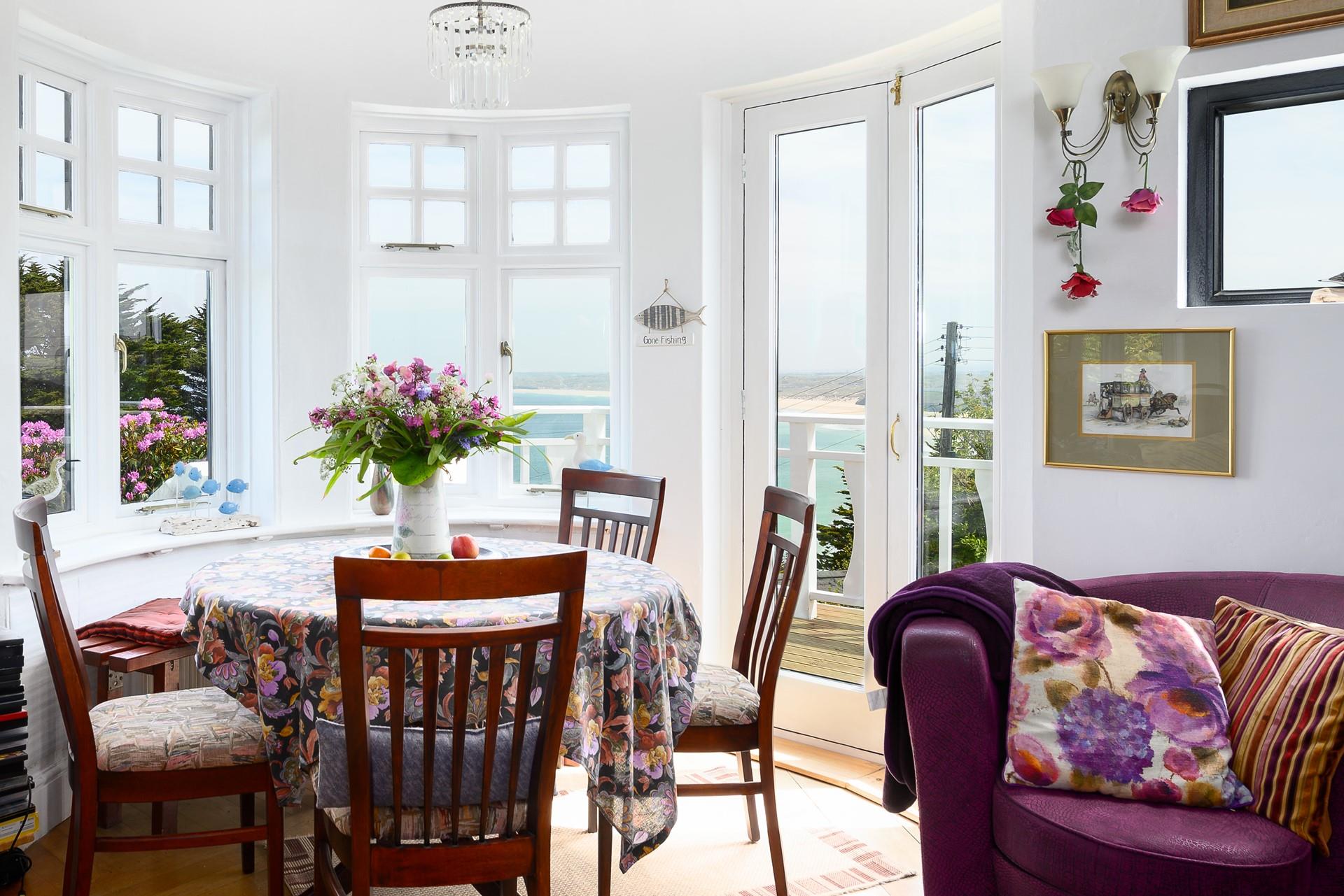 We love this unique curved room, with patio doors leading onto the terrace and views across Carbis Bay.