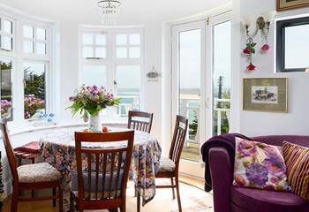 We love this unique curved room, with patio doors leading onto the terrace and views across Carbis Bay.